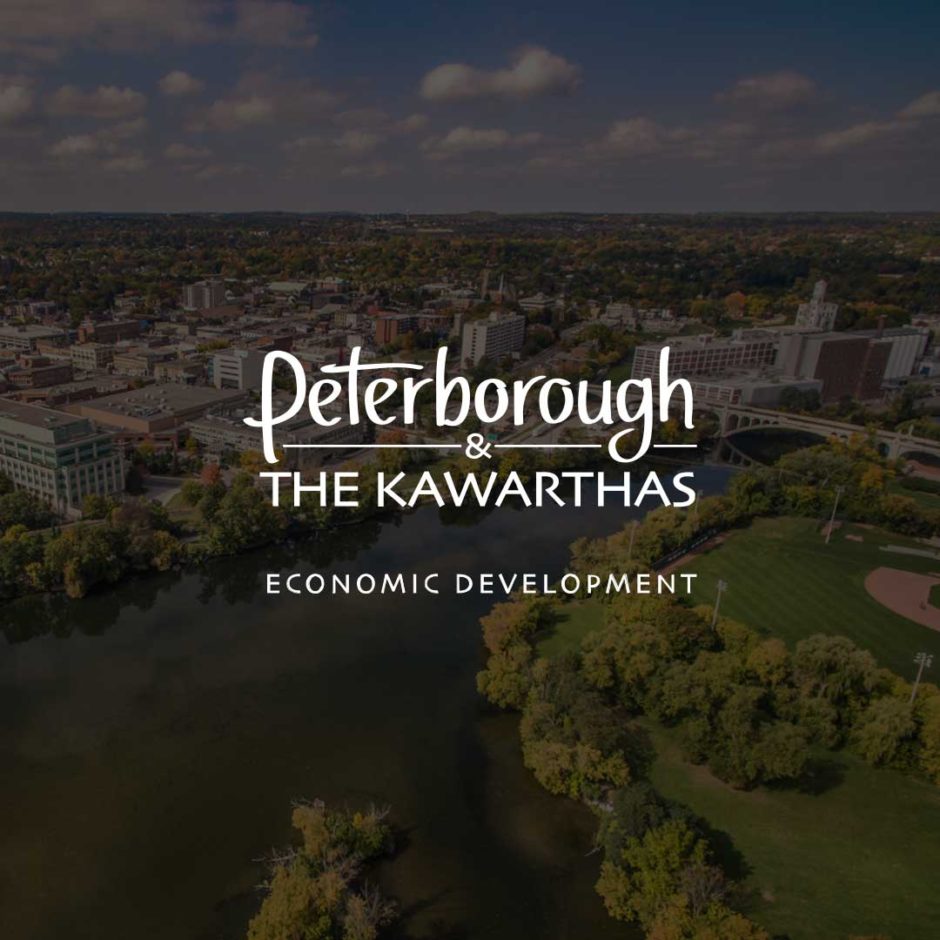 An aerial view of Peterborough & the Kawarthas. The Peterborough & the Kawarthas Economic Development logo is shown on top of the image.