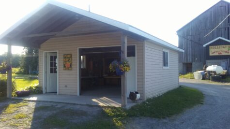 Holliday's Farm Fresh Vegetables farm store building and barn