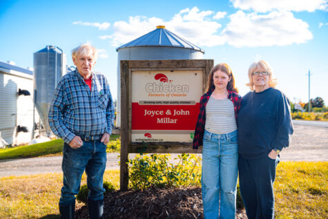 Millar Farm sign with family