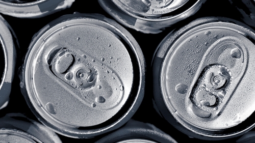 Beverage can tops with condensation drops on them